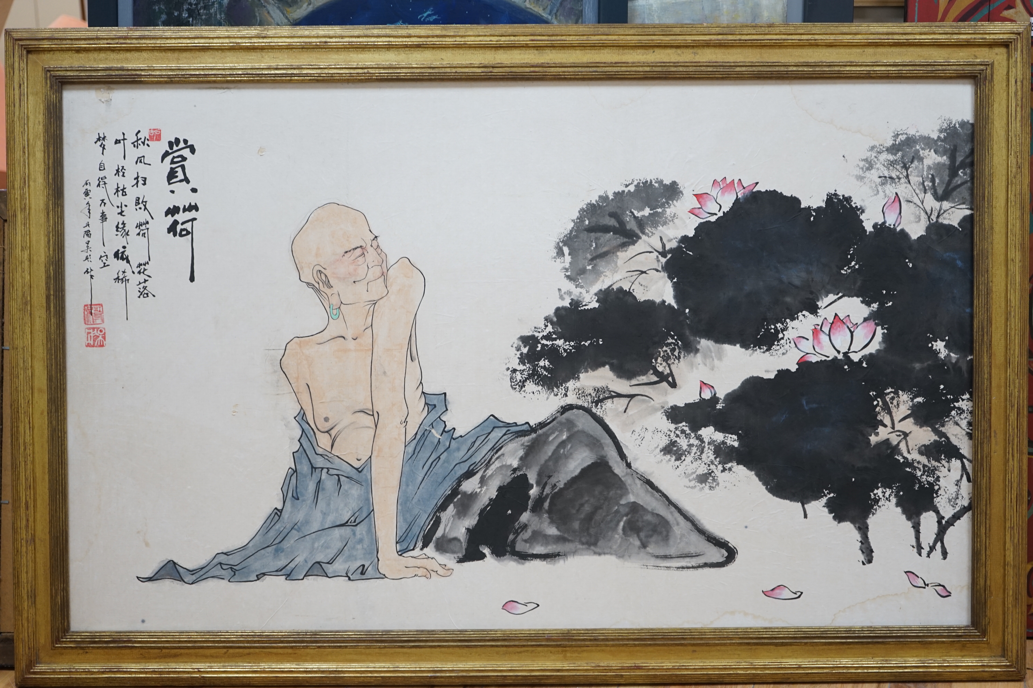 A large Chinese watercolour of a seated figure beside lotus flowers, 66 x 110cm